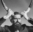 Handsome young man with long beard and moustache in black jacket holding animal antlers in studio on grey background
Мужчина Овен - ИА SakhaLife.Ru