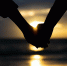 Symbols of love. silhouette Couple of man and woman hand holding together on sea and sky background during sunset for friendship day, love and valentines day concept
любовь - ИА SakhaLife.Ru