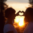 Silhouettes of romantic couple in love in the evening. Bearded man and happy woman making a heart with hands, smiling and looking at each. Amazing sunset, cloudy sky and forest on blurred background
восточный гороскоп любви
любовь - ИА SakhaLife.Ru
